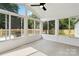 Bright sunroom with large windows and a view of the yard and deck at 3801 Rea Rd, Charlotte, NC 28226