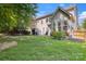 Spacious backyard with lush green grass, mature trees, privacy fence, and patio space perfect for outdoor relaxation at 4121 Cedar Point Ave # 28, Stallings, NC 28104