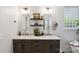 Stylish bathroom with a marble countertop, double sink vanity, and modern fixtures, with two decorative shelves at 4121 Cedar Point Ave # 28, Stallings, NC 28104