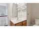Upstairs bathroom features a single sink vanity with a large mirror and open shelving for storage at 4121 Cedar Point Ave # 28, Stallings, NC 28104