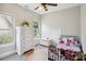 Cozy bedroom with plush carpet, two windows, a comfortable bed, and a white dresser with storage at 4121 Cedar Point Ave # 28, Stallings, NC 28104
