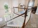 Open foyer features stairs with wooden railing, large window and chandelier, leading to an upstairs playroom at 4121 Cedar Point Ave # 28, Stallings, NC 28104