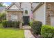 Charming home featuring a stone and vinyl exterior, well-manicured landscaping, and a modern door at 4121 Cedar Point Ave # 28, Stallings, NC 28104