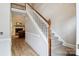Elegant hallway with hardwood floors, wainscoting, staircase, and a glimpse of the living room at 4121 Cedar Point Ave # 28, Stallings, NC 28104