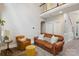 Inviting living room with high ceilings, leather furniture, and natural light at 4121 Cedar Point Ave # 28, Stallings, NC 28104