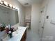Bright bathroom with a single sink vanity, vanity lighting, and ample counter space at 4574 Ivy Run Ln, Denver, NC 28037