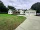 Charming home featuring a large, well-maintained yard and detached two-car garage at 4574 Ivy Run Ln, Denver, NC 28037