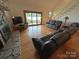 Cozy living room with a fireplace and sliding glass door to the backyard at 4574 Ivy Run Ln, Denver, NC 28037