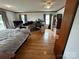 Spacious living area with hardwood floors, a ceiling fan, and lots of natural light at 4574 Ivy Run Ln, Denver, NC 28037