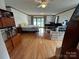Bright living area with hardwood floors, neutral walls, and a view of the outside patio and lake at 4574 Ivy Run Ln, Denver, NC 28037