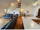Open-concept living area with a kitchen island and hardwood floors at 4574 Ivy Run Ln, Denver, NC 28037