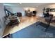 Spacious living room with hardwood floors and ample space for various activities at 4574 Ivy Run Ln, Denver, NC 28037