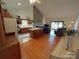 Bright living room featuring a stone fireplace and open floor plan at 4574 Ivy Run Ln, Denver, NC 28037