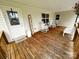 Cozy front porch featuring a wooden floor and rocking chairs at 4574 Ivy Run Ln, Denver, NC 28037