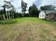 Lush yard with privacy trees bordering a charming home at 4574 Ivy Run Ln, Denver, NC 28037