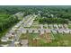 Neighborhood aerial view with well-maintained homes, green lawns, and tree-lined streets at 515 Benford Ln, Stanley, NC 28164