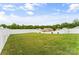 Expansive backyard featuring a well-maintained lawn enclosed by a white fence at 515 Benford Ln, Stanley, NC 28164