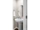 Charming powder room featuring pedestal sink, round mirror, and towel ring at 515 Benford Ln, Stanley, NC 28164