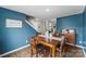 Charming dining room with hardwood floors, a wooden table, and staircase access, perfect for Gathering meals at 515 Benford Ln, Stanley, NC 28164