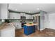 Bright kitchen with stainless steel appliances, ample counter space, and a central island for food preparation at 515 Benford Ln, Stanley, NC 28164