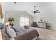 Comfortable main bedroom with vaulted ceiling, neutral paint, ceiling fan, and sitting area at 515 Benford Ln, Stanley, NC 28164
