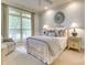 Serene bedroom with large window, neutral colors, and soft textures at 525 Queens Rd, Charlotte, NC 28207