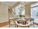 Open-concept breakfast nook near stairway, featuring hardwood floors at 525 Queens Rd, Charlotte, NC 28207
