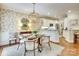 Bright breakfast nook with floral wallpaper, hardwood floor, and table at 525 Queens Rd, Charlotte, NC 28207