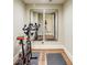 Home gym includes wood floor, exercise bike, and large mirrors, creating a convenient workout space at 525 Queens Rd, Charlotte, NC 28207