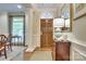 Elegant foyer with hardwood floors, arched doorway, and decorative molding at 525 Queens Rd, Charlotte, NC 28207