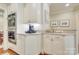 Built-in stainless oven with white cabinets and stone countertops at 525 Queens Rd, Charlotte, NC 28207