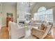 Bright living room with vaulted ceilings, fireplace, and large windows at 525 Queens Rd, Charlotte, NC 28207