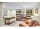 Inviting living room with built-in bookshelves and hardwood floors for a cozy and sophisticated ambiance at 525 Queens Rd, Charlotte, NC 28207