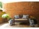 Charming brick patio featuring stylish outdoor seating and decor, perfect for relaxing or entertaining guests at 525 Queens Rd, Charlotte, NC 28207