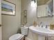 Half bath with a pedestal sink and decorative accents at 525 Queens Rd, Charlotte, NC 28207