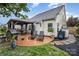 Backyard with a patio, pergola, lawn chairs, and easy access to the house at 5927 Leawood Run Ct, Charlotte, NC 28269