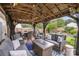 Inviting backyard patio with outdoor furniture and a charming pergola overhead at 5927 Leawood Run Ct, Charlotte, NC 28269