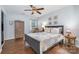 Comfortable bedroom with neutral tones, wood furniture, and a tranquil ambiance at 5927 Leawood Run Ct, Charlotte, NC 28269