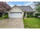 Charming single-Gathering home with a white garage door, manicured lawn, and inviting curb appeal at 5927 Leawood Run Ct, Charlotte, NC 28269
