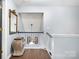 Upstairs hallway with railing, pendant light and decor at 5927 Leawood Run Ct, Charlotte, NC 28269