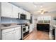 Bright kitchen with stainless steel appliances, white cabinets, and a convenient center island at 5927 Leawood Run Ct, Charlotte, NC 28269