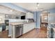 Well-lit kitchen with stainless steel appliances, ample counter space, and an open view to the living room at 5927 Leawood Run Ct, Charlotte, NC 28269