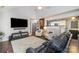 Bright living room with an open layout, hardwood floors, and access to the kitchen for easy entertaining at 5927 Leawood Run Ct, Charlotte, NC 28269