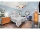 Serene main bedroom with vaulted ceiling, accent wall, and plenty of natural light at 5927 Leawood Run Ct, Charlotte, NC 28269