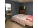Comfortable bedroom with blue walls, ceiling fan and a plush quilt-covered bed, creating a cozy retreat at 600 Colby Cir, Salisbury, NC 28147