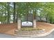 Entrance sign to Heathstead a condominium community, surrounded by mature trees and landscaping at 6101 Heath Ridge Ct, Charlotte, NC 28210