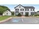 Striking three-story building with black shutters, fresh landscaping and accessible parking at 6101 Heath Ridge Ct, Charlotte, NC 28210