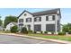 Charming building featuring a crisp white exterior, dark shutters, and well-manicured landscaping at 6101 Heath Ridge Ct, Charlotte, NC 28210