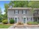 Charming two-story townhome exterior with well-maintained landscaping and inviting entrance at 6101 Heath Ridge Ct, Charlotte, NC 28210