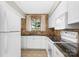 Modern kitchen design with white cabinetry, stainless steel appliances, and an inviting atmosphere at 6101 Heath Ridge Ct, Charlotte, NC 28210